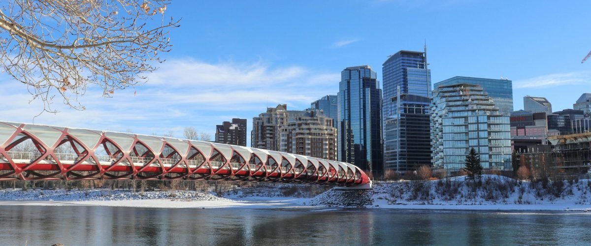pexels-photo-31517768-31517768-1 A winter scene of the Peace Bridge over Bow River with Calgary skyline.